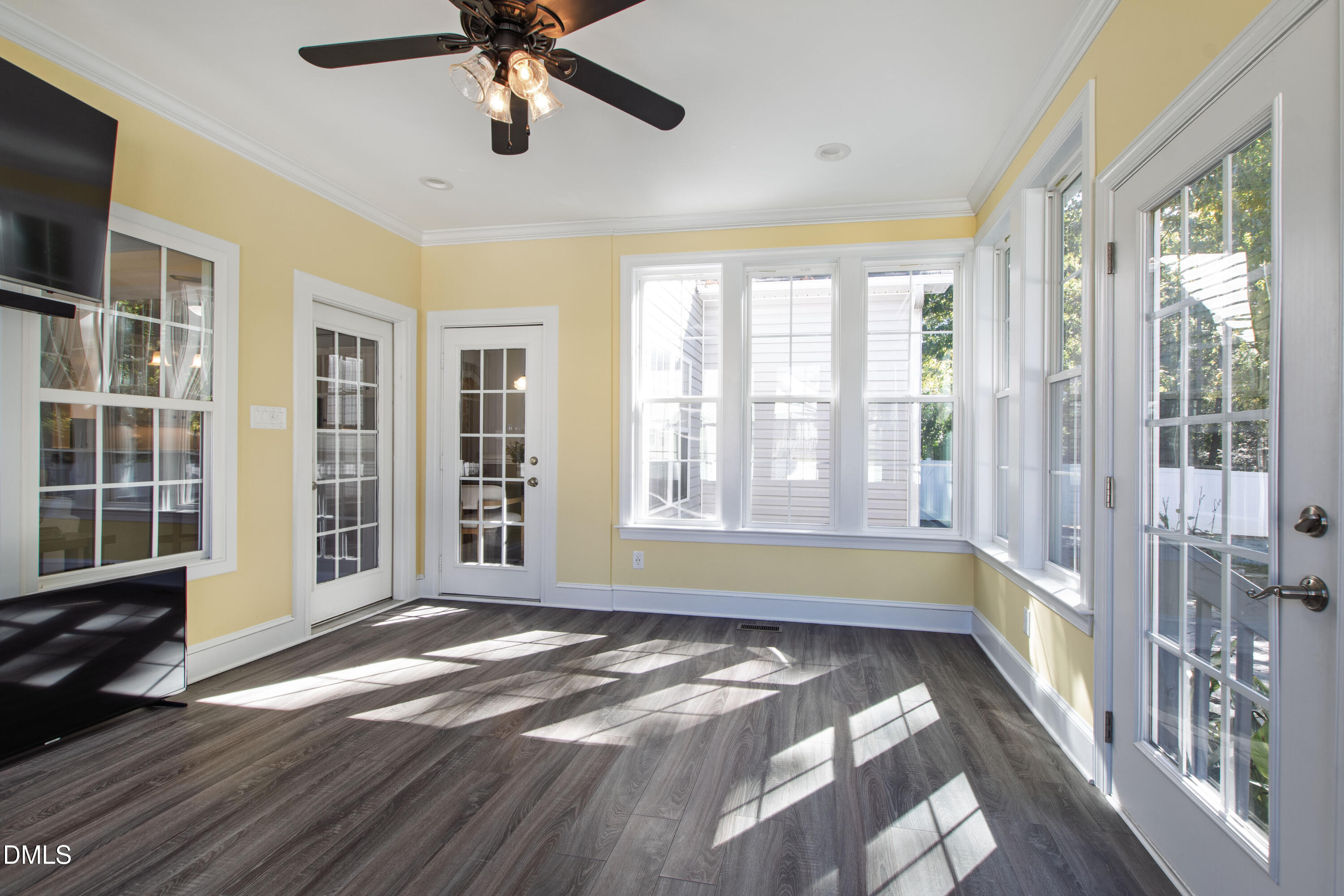 212 Fox Pen Drive Raleigh, NC 27603 - Photo 41 of 56 a view of an empty room with a window and wooden floor