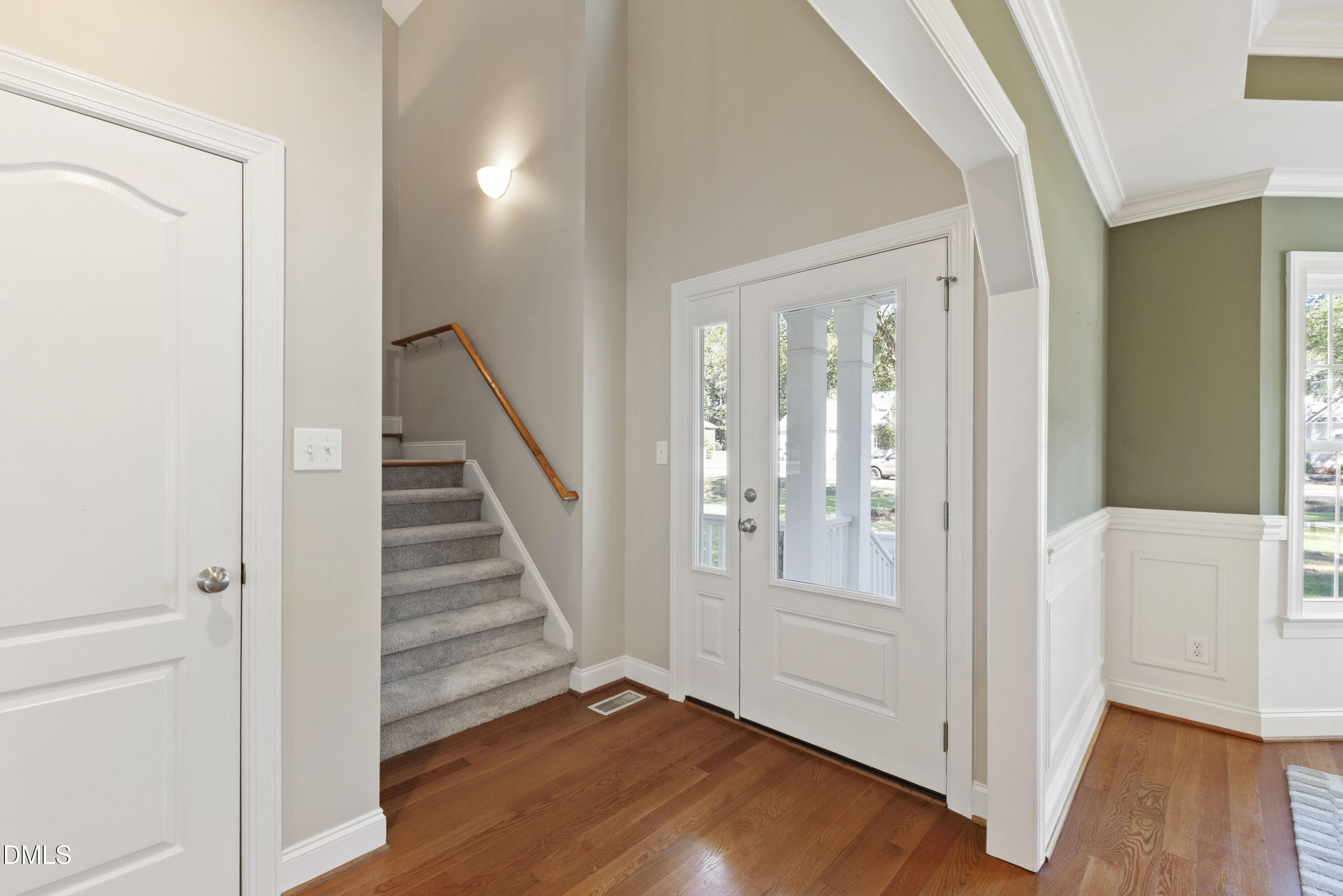 212 Fox Pen Drive Raleigh, NC 27603 - Photo 4 of 56 a view of a hallway with wooden floor and entryway