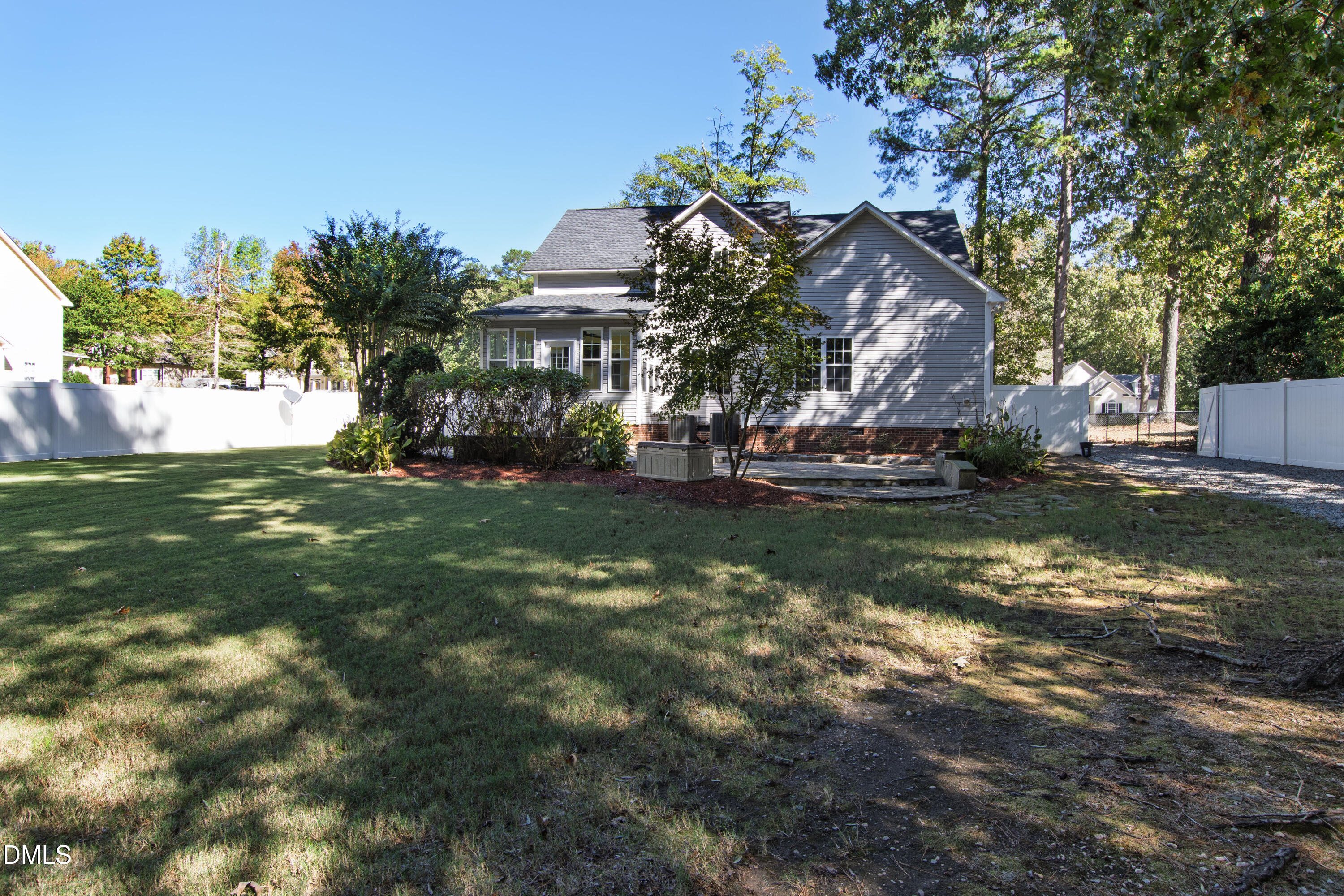 212 Fox Pen Drive Raleigh, NC 27603 - Photo 51 of 56 a front view of a house with a garden and yard