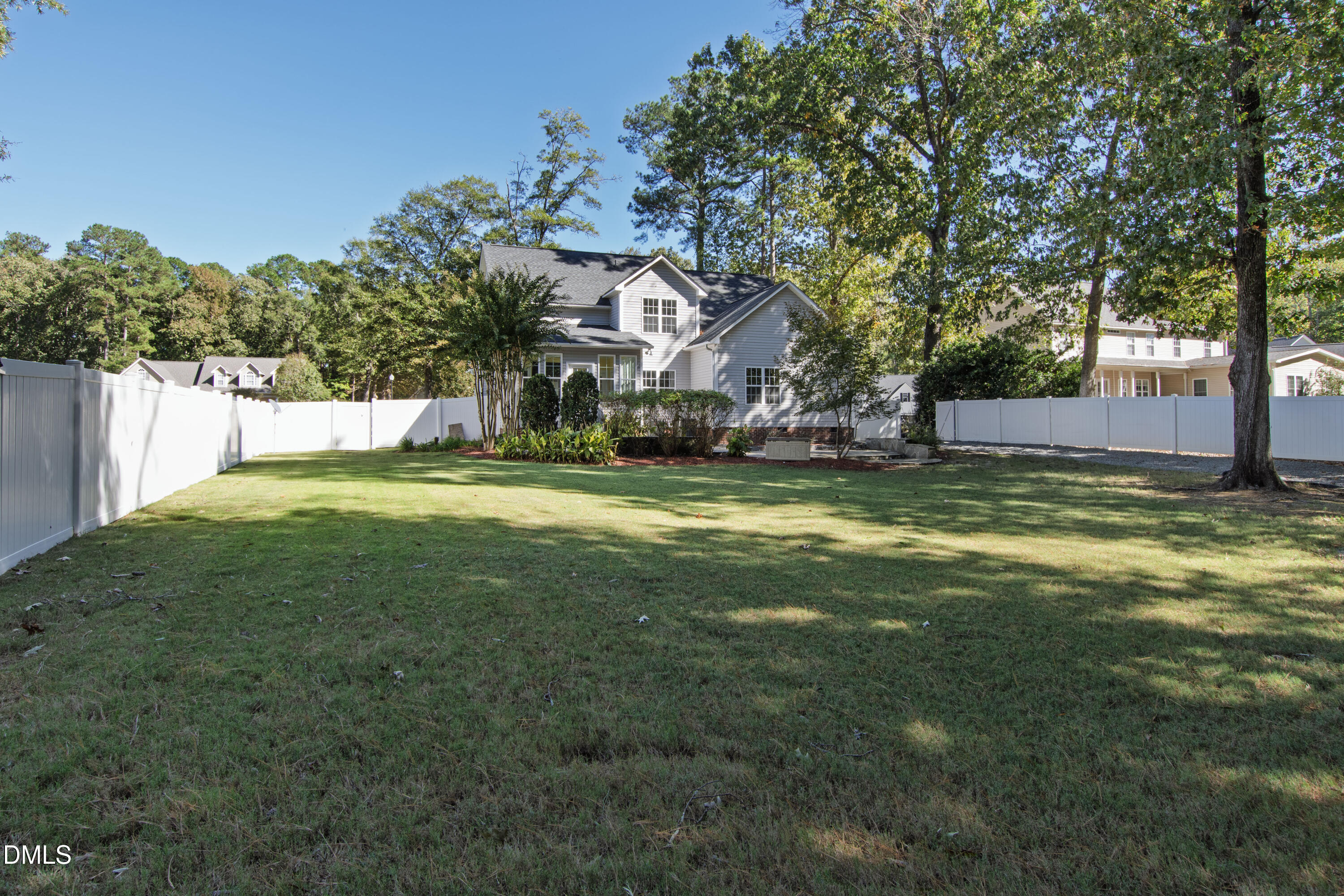 212 Fox Pen Drive Raleigh, NC 27603 - Photo 52 of 56 a view of a house with a big yard and large trees