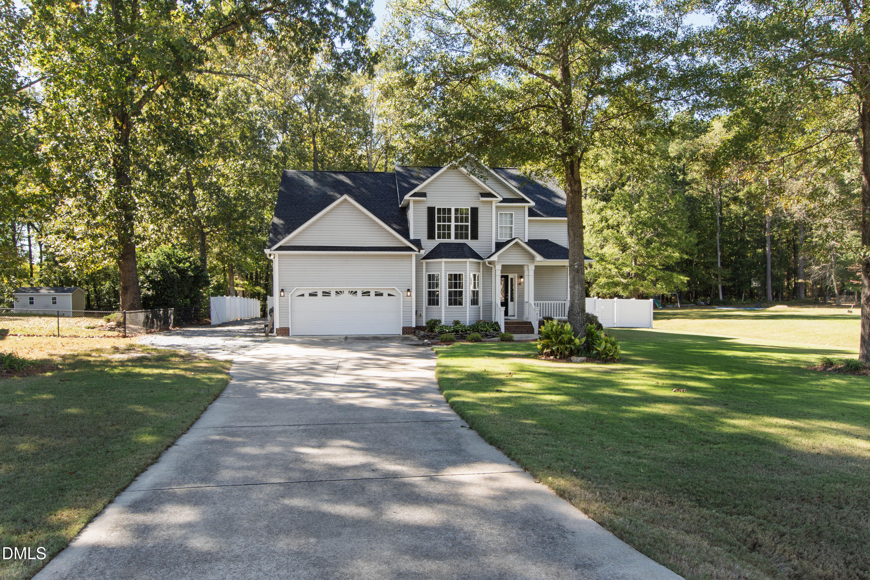 212 Fox Pen Drive Raleigh, NC 27603 - Photo 53 of 56 a front view of a house with a yard
