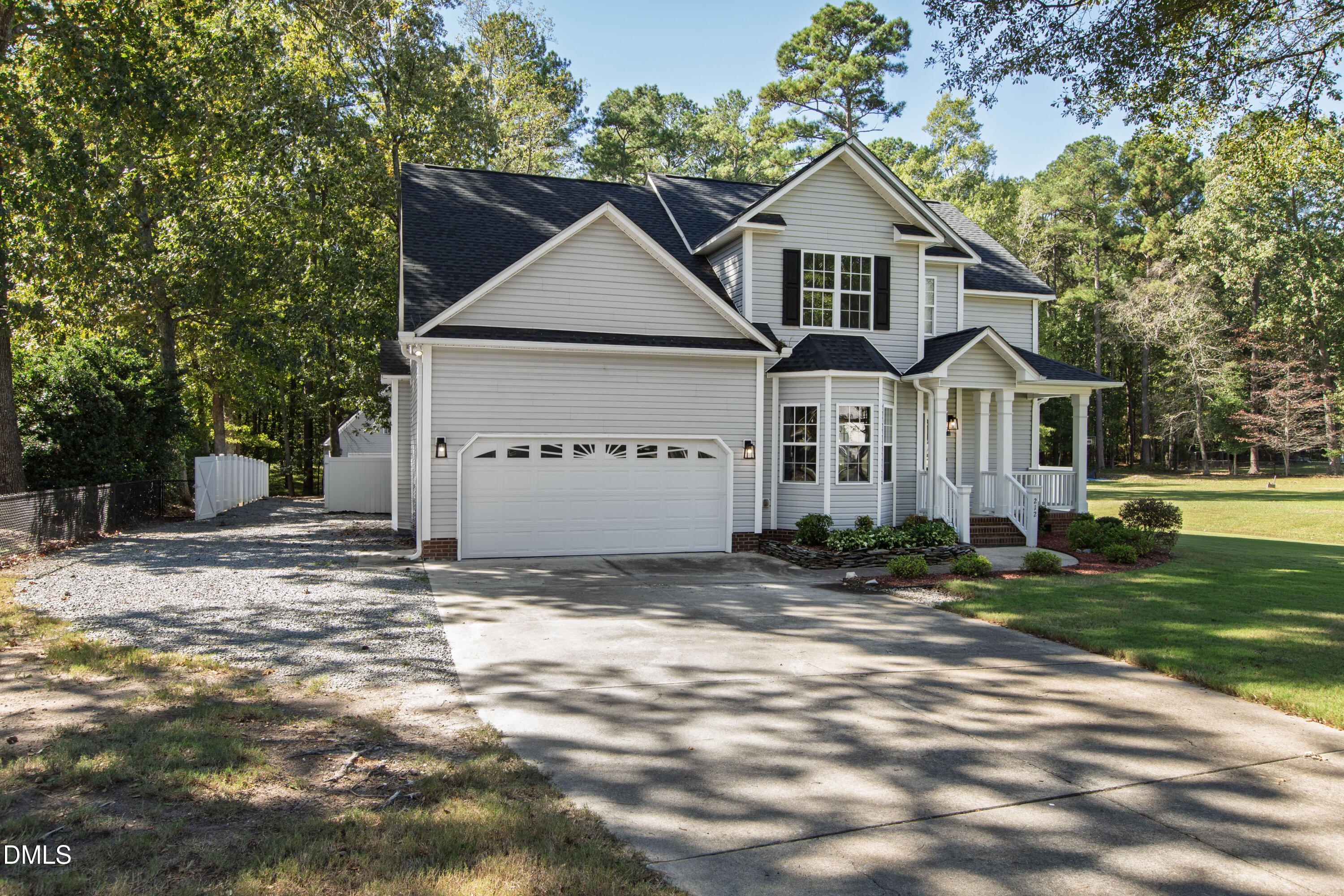 212 Fox Pen Drive Raleigh, NC 27603 - Photo 55 of 56 a view of a big house with a big yard and large trees