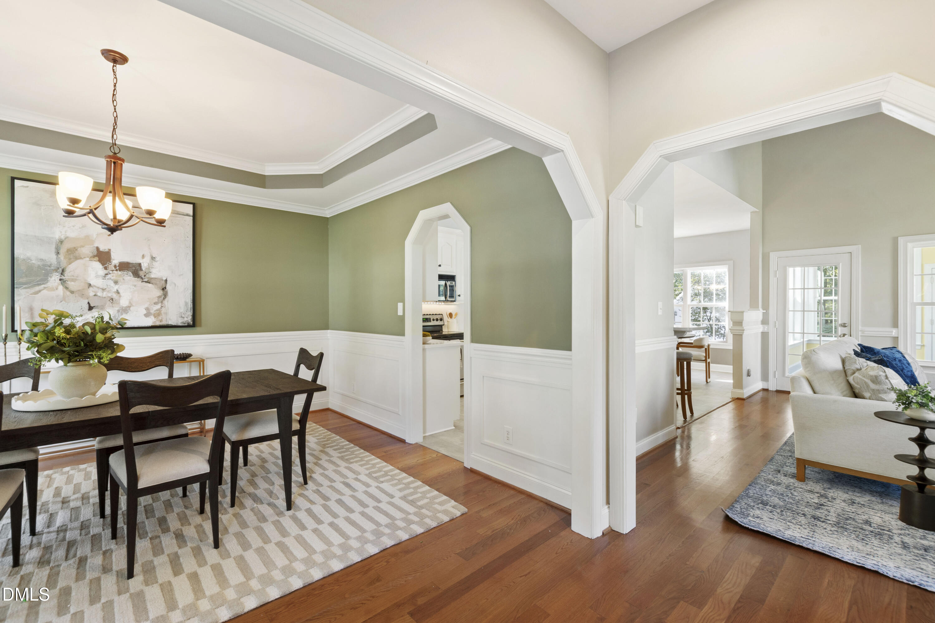 212 Fox Pen Drive Raleigh, NC 27603 - Photo 5 of 56 a view of a dining room with furniture and wooden floor