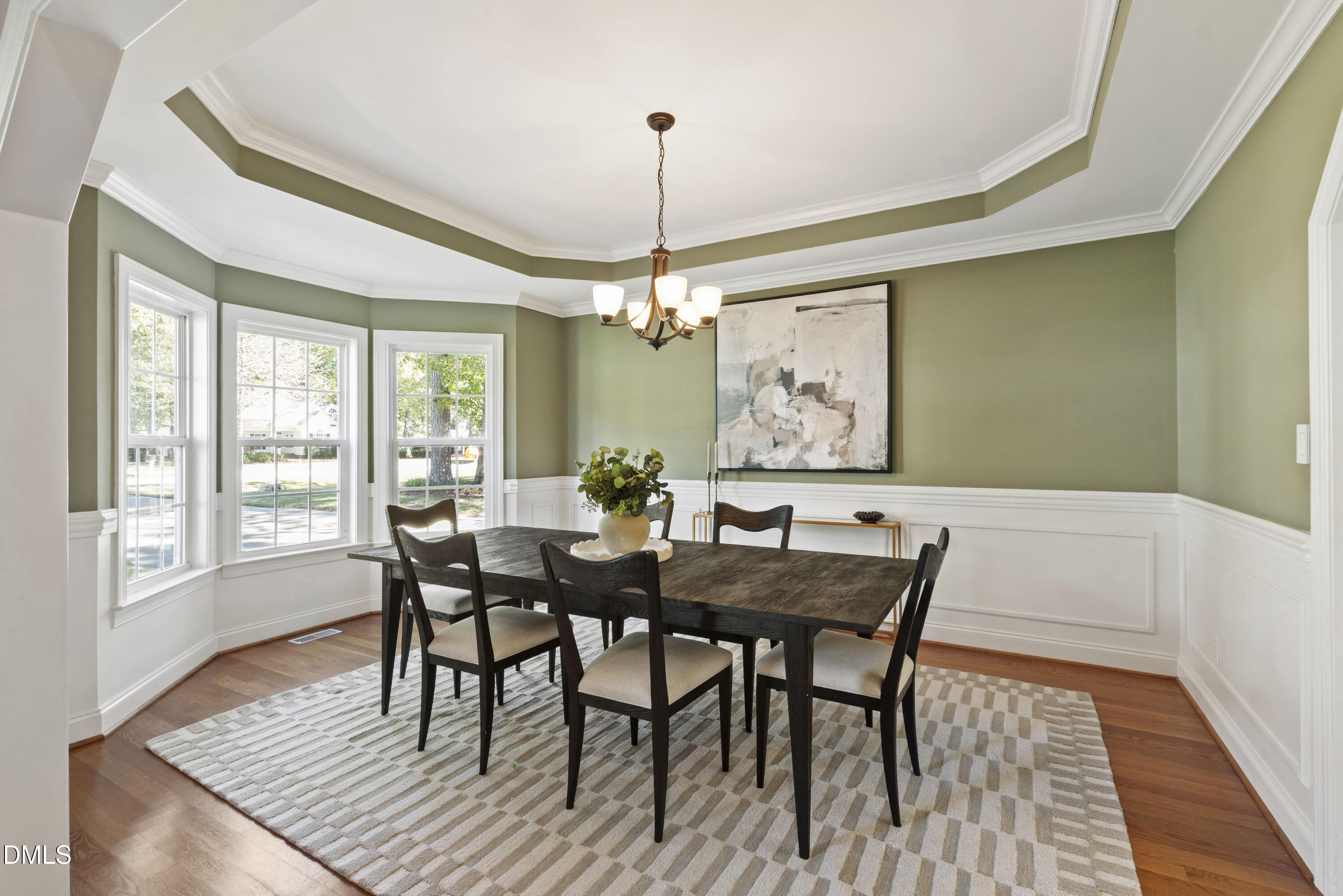 212 Fox Pen Drive Raleigh, NC 27603 - Photo 6 of 56 a view of a dining room with furniture window and wooden floor