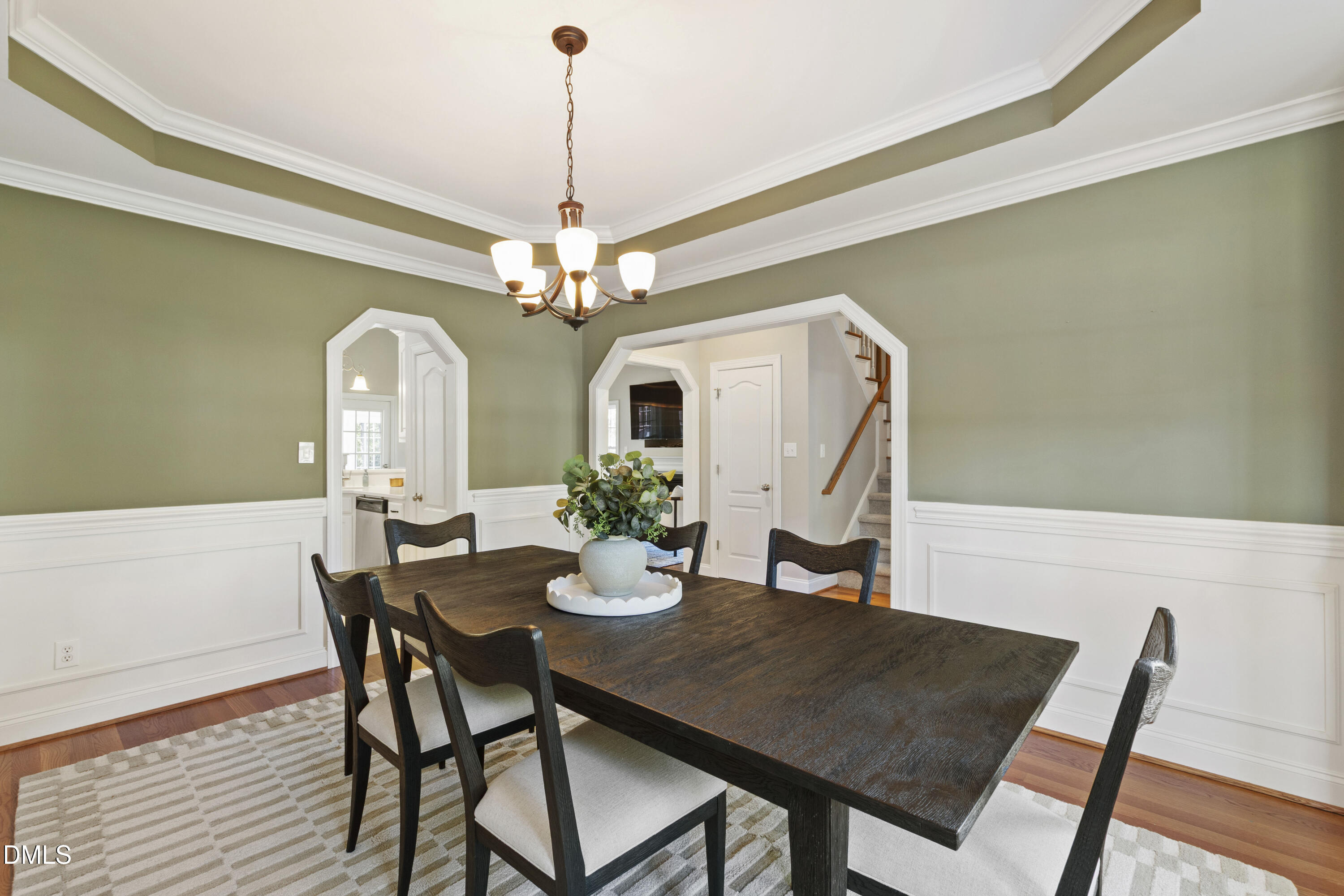 212 Fox Pen Drive Raleigh, NC 27603 - Photo 7 of 56 a view of a dining room with furniture and chandelier