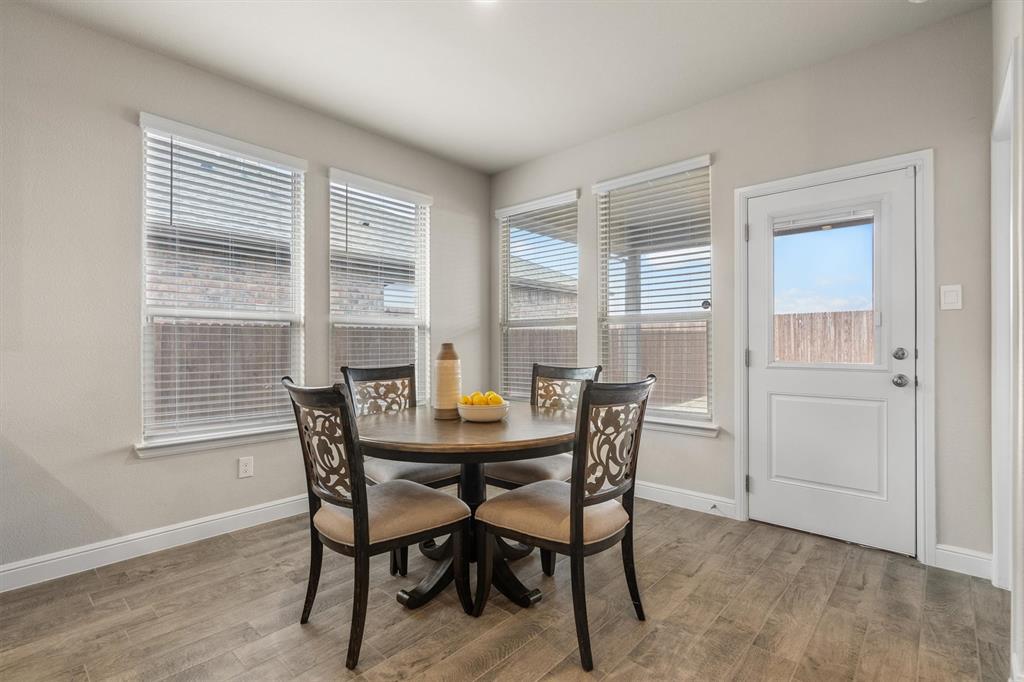1864 Mensa Drive Haslet, TX 76052 - Photo 22 of 40 a view of a dining room with furniture and window
