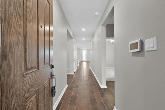 a view of hallway with livingroom