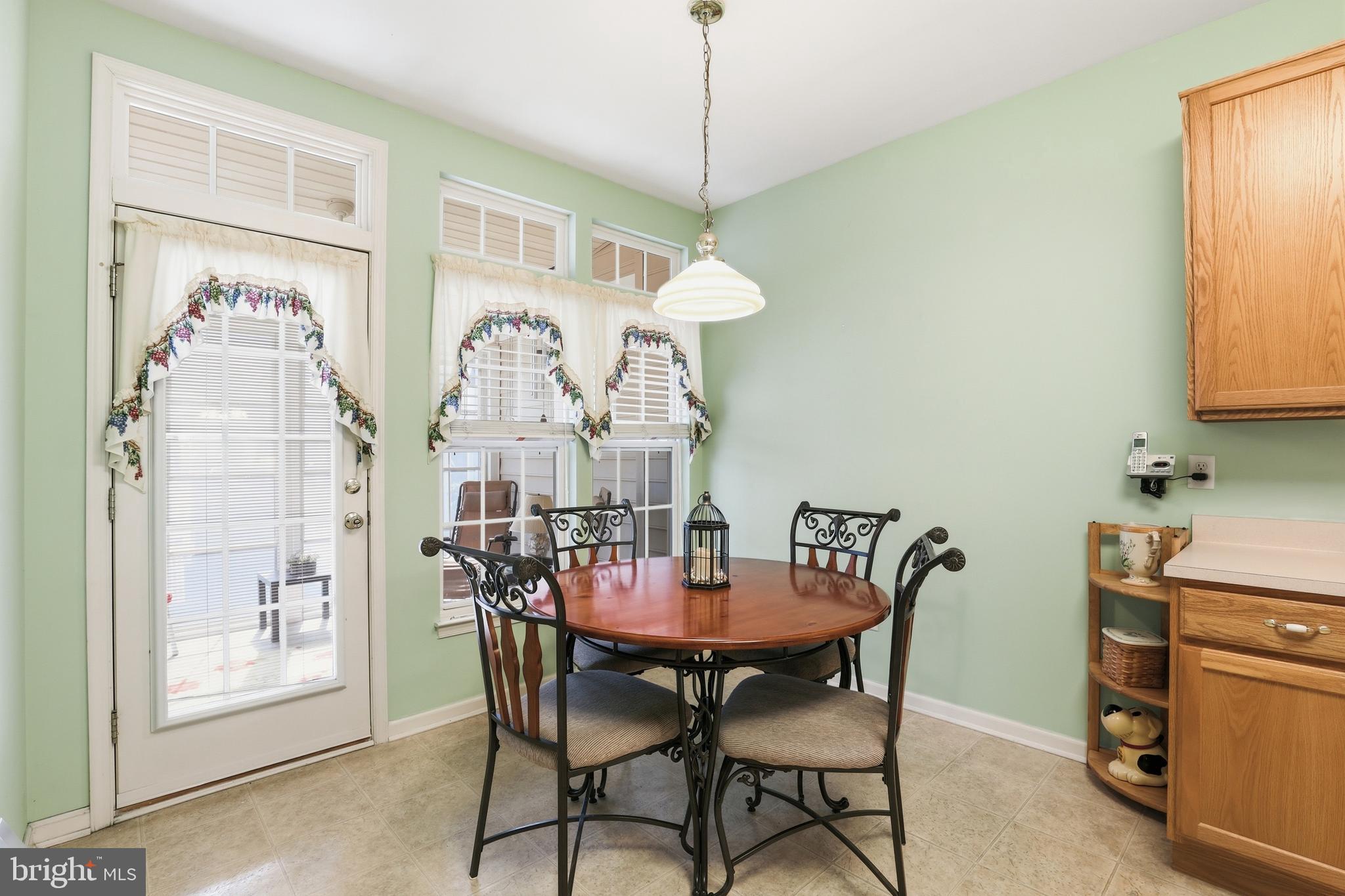 40 Brighton Street Ocean View, DE 19970 - Photo 13 of 38 a view of a dining room with furniture and a chandelier