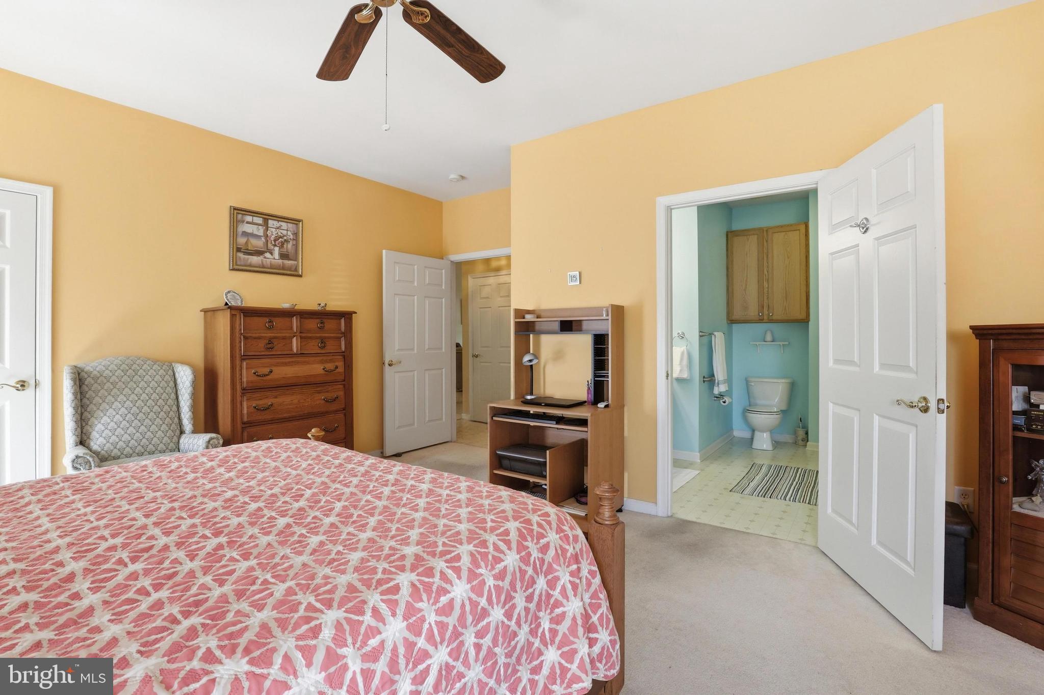 40 Brighton Street Ocean View, DE 19970 - Photo 18 of 38 a bedroom with a bed and a dresser