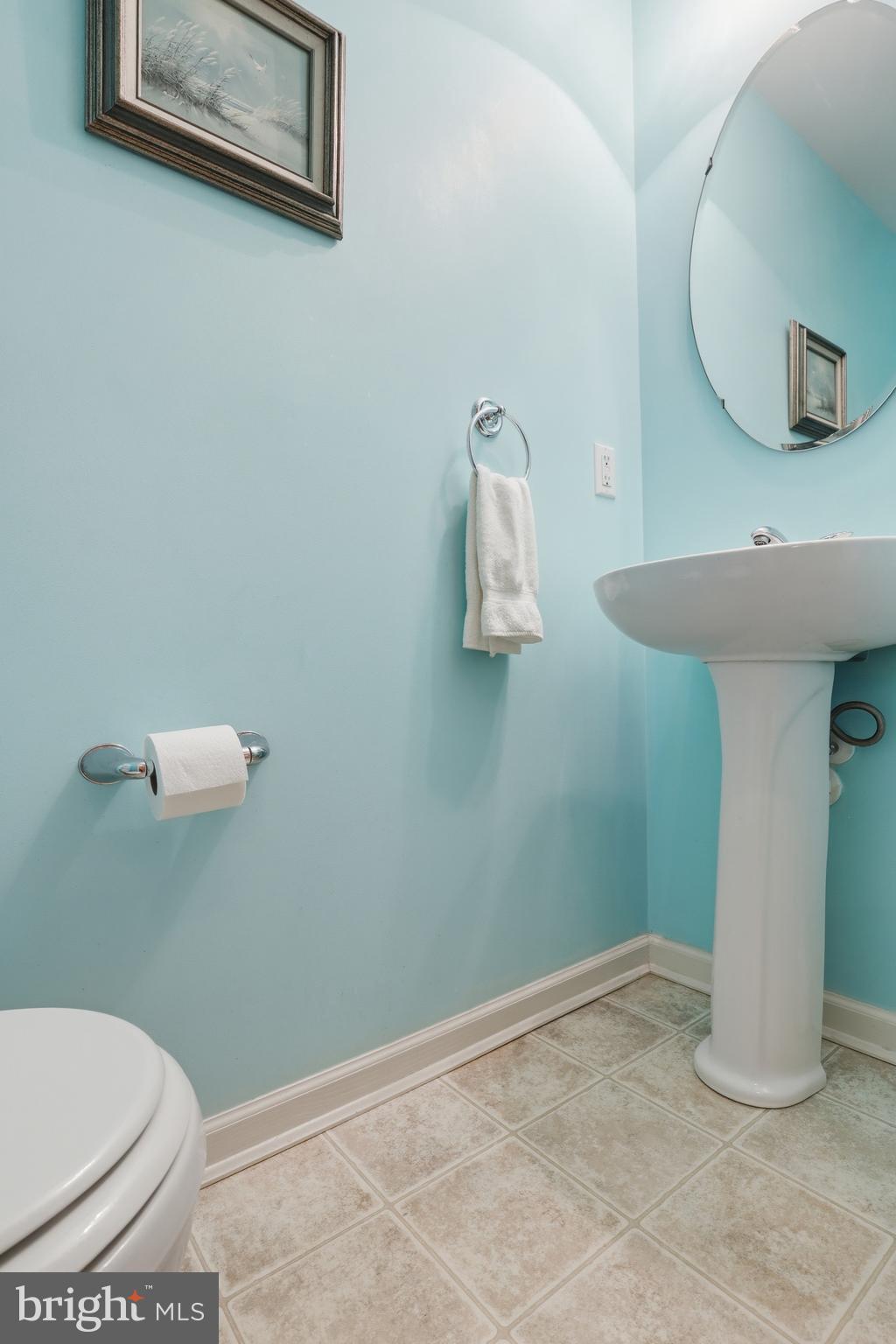 40 Brighton Street Ocean View, DE 19970 - Photo 23 of 38 a bathroom with a sink and a mirror