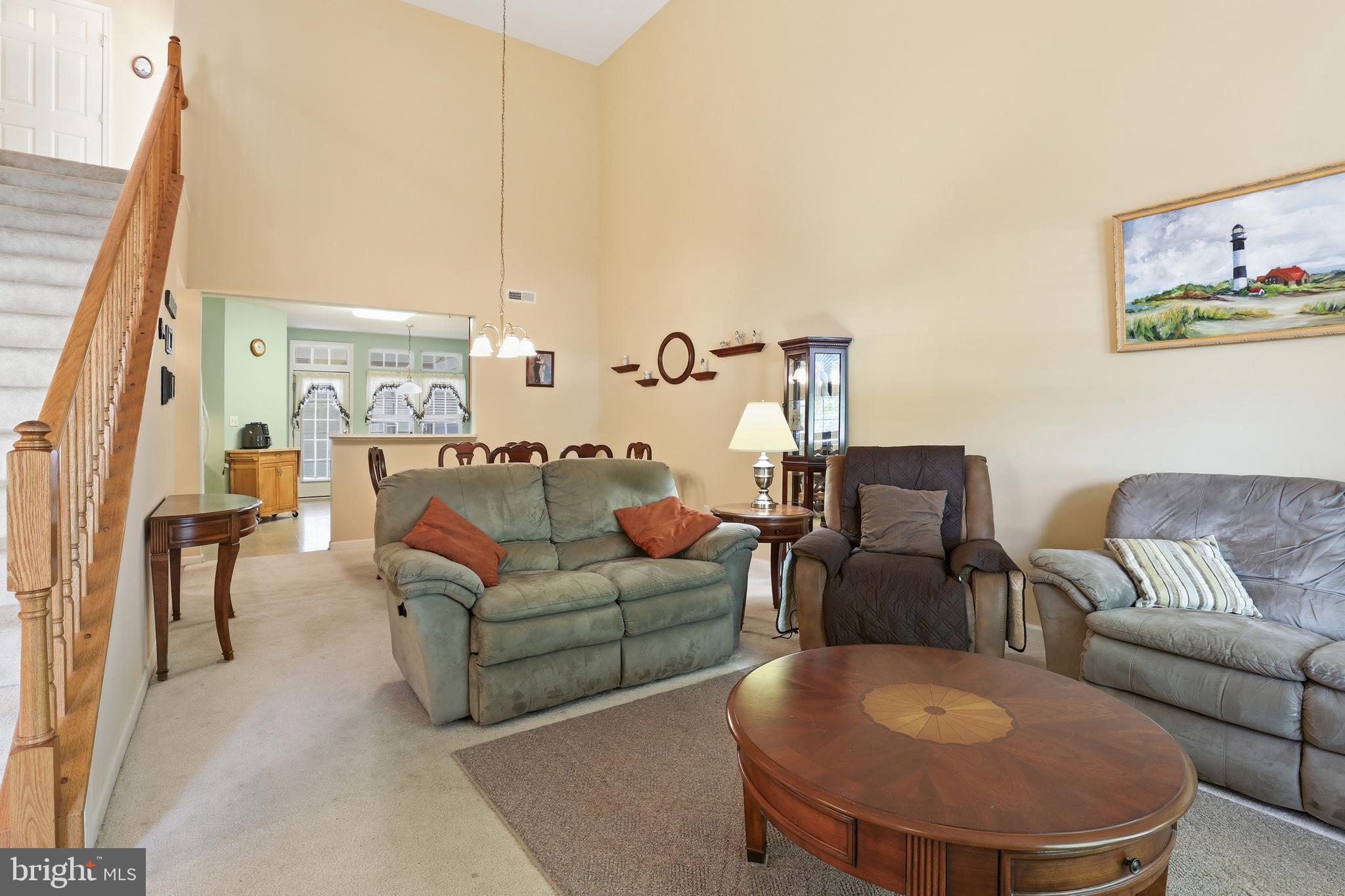 40 Brighton Street Ocean View, DE 19970 - Photo 6 of 38 a living room with furniture and a large window
