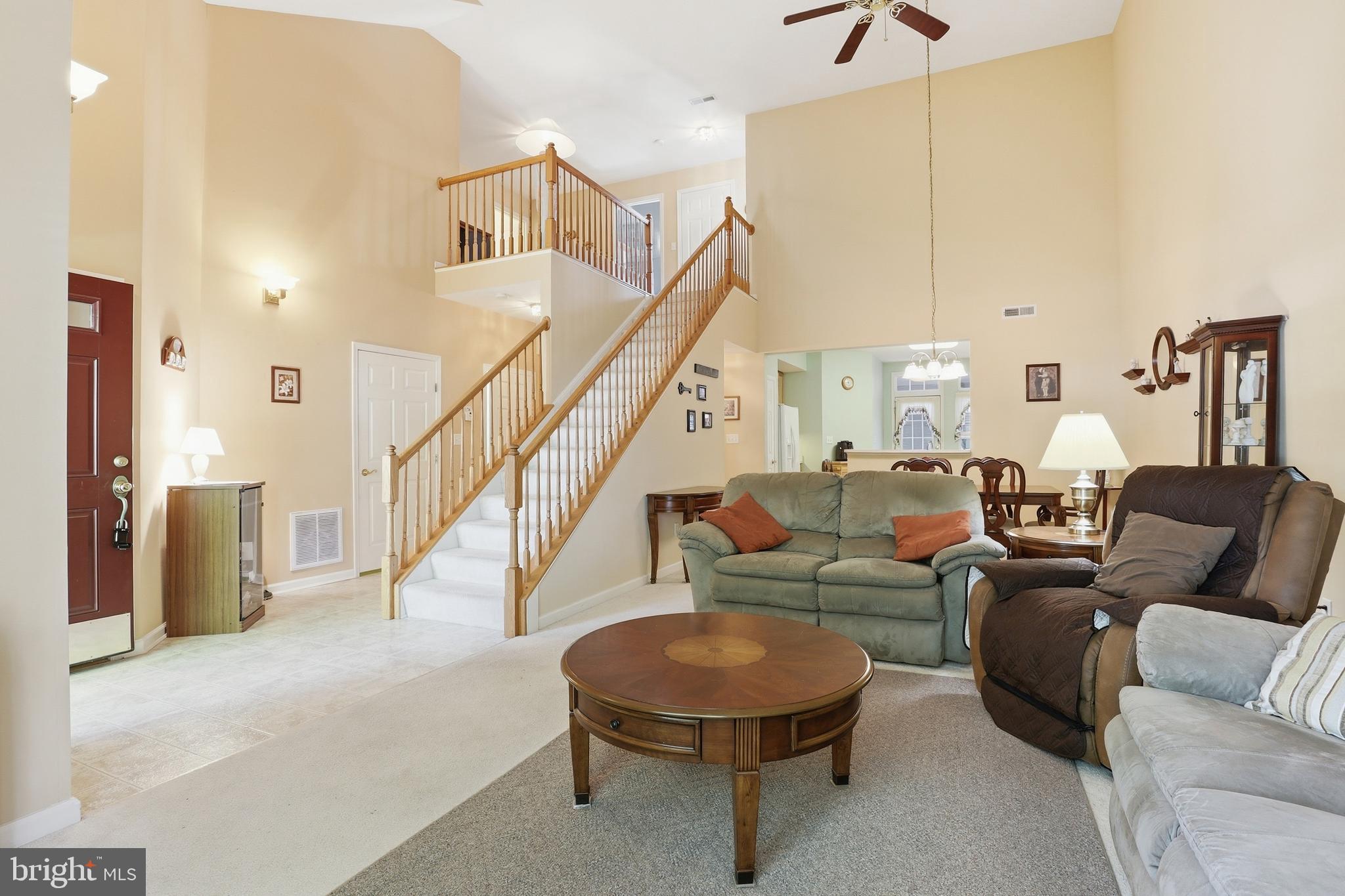 40 Brighton Street Ocean View, DE 19970 - Photo 7 of 38 a living room with furniture and a ceiling fan