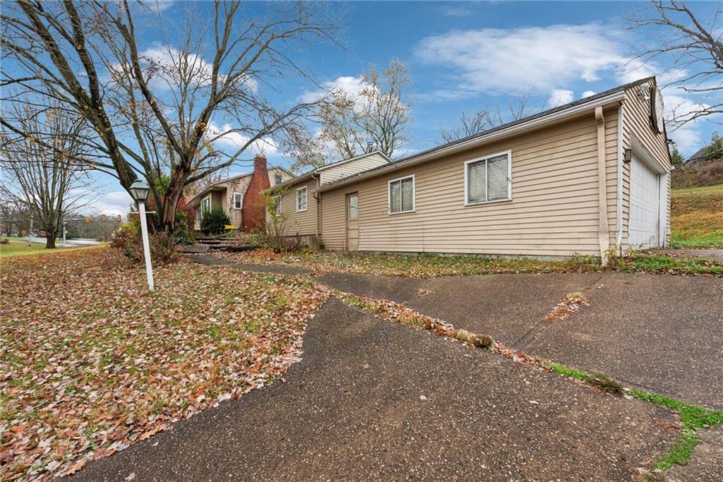 357 East McMurray Road Canonsburg, PA 15317 - Photo 18 of 21 a backyard of a house with large trees and a barn