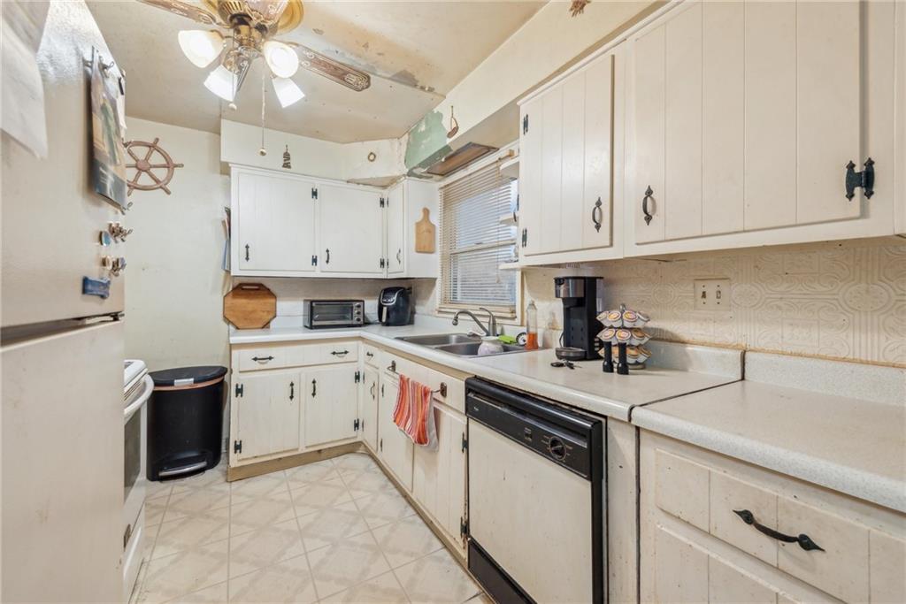 357 East McMurray Road Canonsburg, PA 15317 - Photo 7 of 21 a kitchen with cabinets appliances a sink and a counter top space