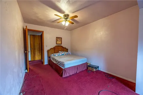 a view of hallway with wooden floor