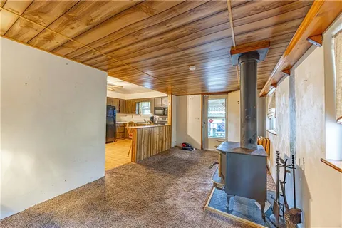 a kitchen with stainless steel appliances kitchen island granite countertop a sink and cabinets