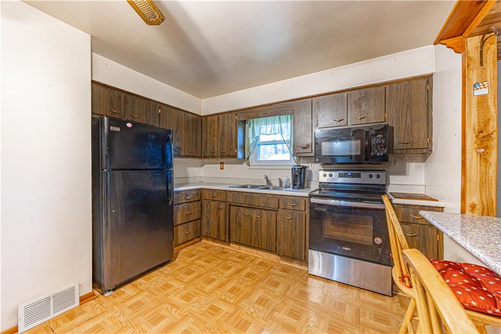 520 Farneth Road New Kensington, PA 15068 - Photo 7 of 20 a kitchen with a refrigerator stove and sink
