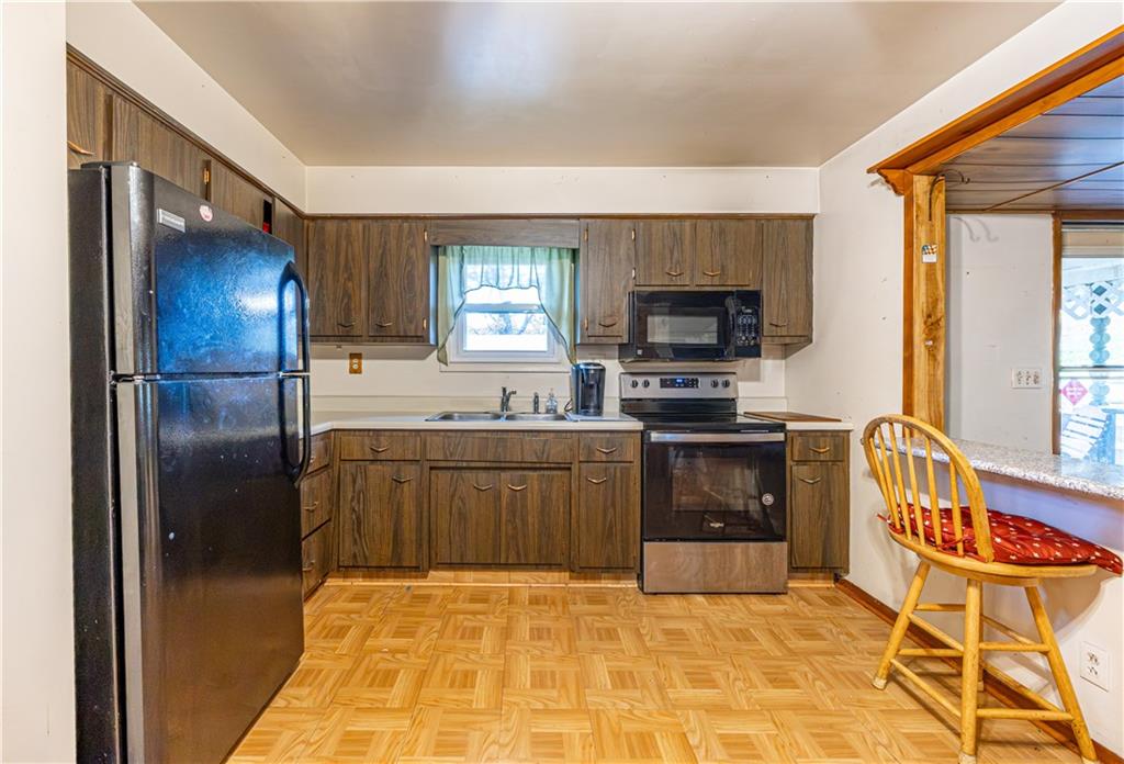 520 Farneth Road New Kensington, PA 15068 - Photo 8 of 20 a kitchen with stainless steel appliances granite countertop a refrigerator and a stove top oven