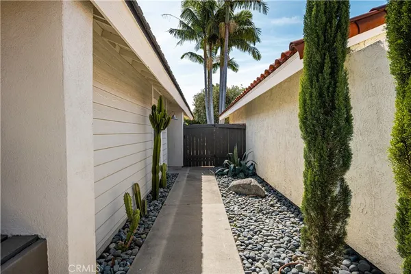 a view of a house with backyard porch and sitting area