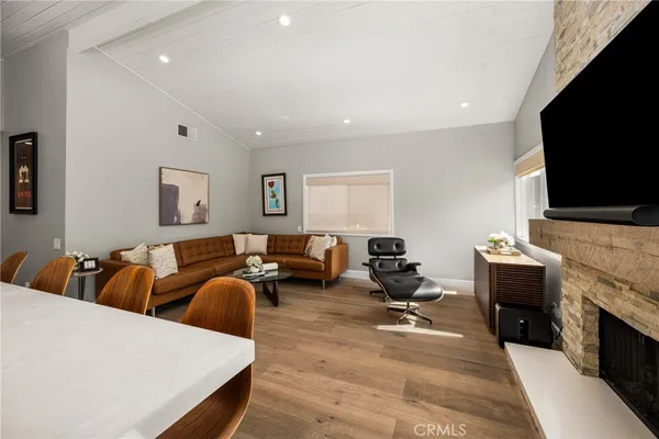 a living room with fireplace furniture and a flat screen tv