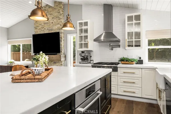 a kitchen with a sink and a large window