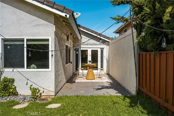 a view of swimming pool with a table and chairs
