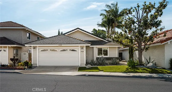 an aerial view of a house with a garden