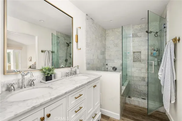 a bed room with a bed a television and a large window