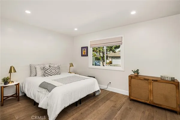 a bathroom with a granite countertop sink mirror shower and double