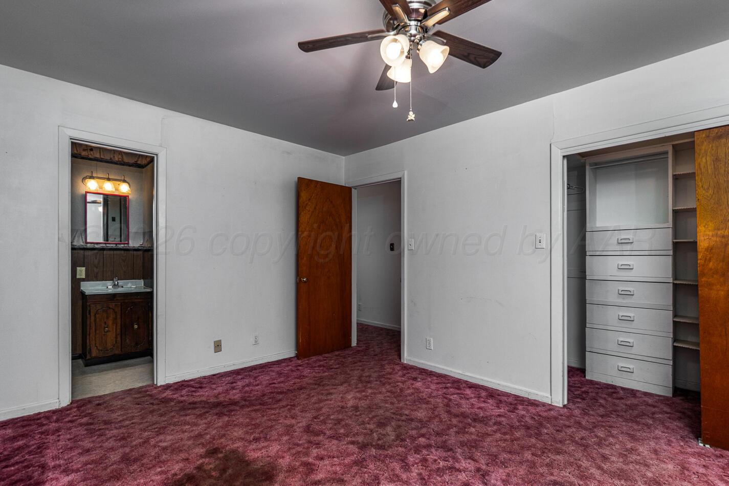 300 Mccarthy Street Borger, TX 79007 - Photo 19 of 31 a view of an empty room with a cabinet and a flat screen tv