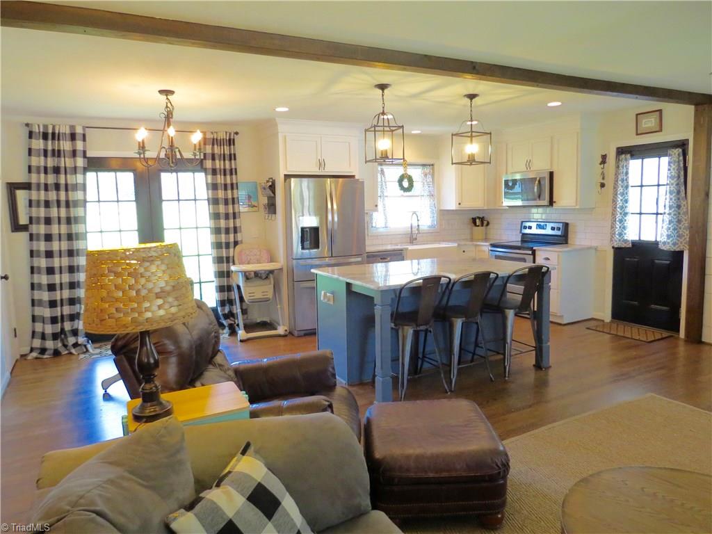 116 Longbow Road Reidsville, NC 27320 - Photo 20 of 20 Large open floor plan including kitchen, dining room and living room area all with gorgeous hardwood floors.