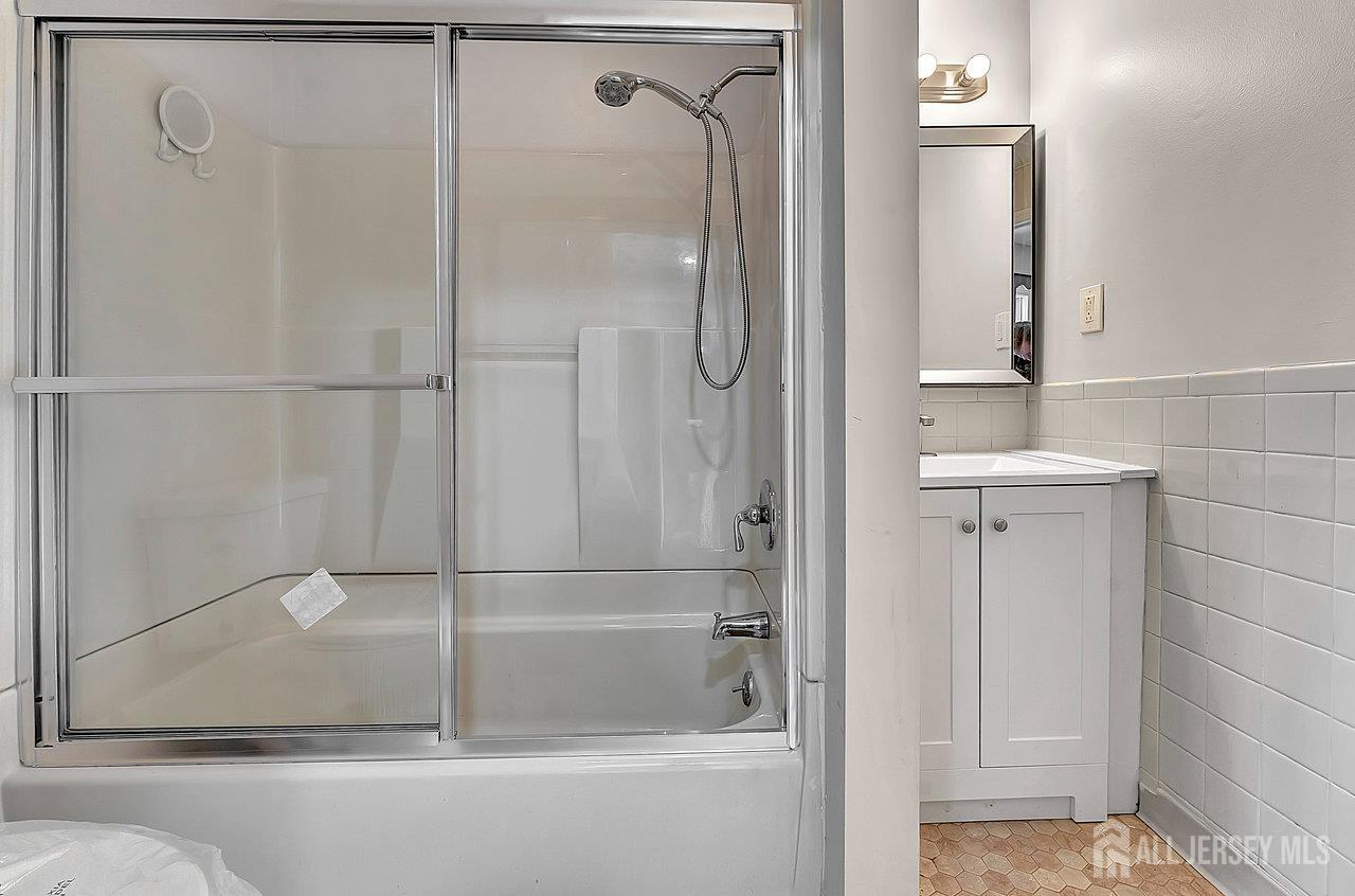 601 Ridgeway Avenue South Amboy, NJ 08879 - Photo 13 of 36 a bathroom with a glass shower door