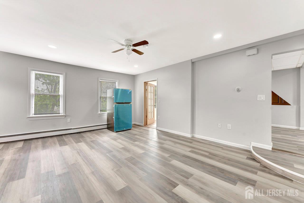 601 Ridgeway Avenue South Amboy, NJ 08879 - Photo 17 of 36 a view of empty room with wooden floor and fan