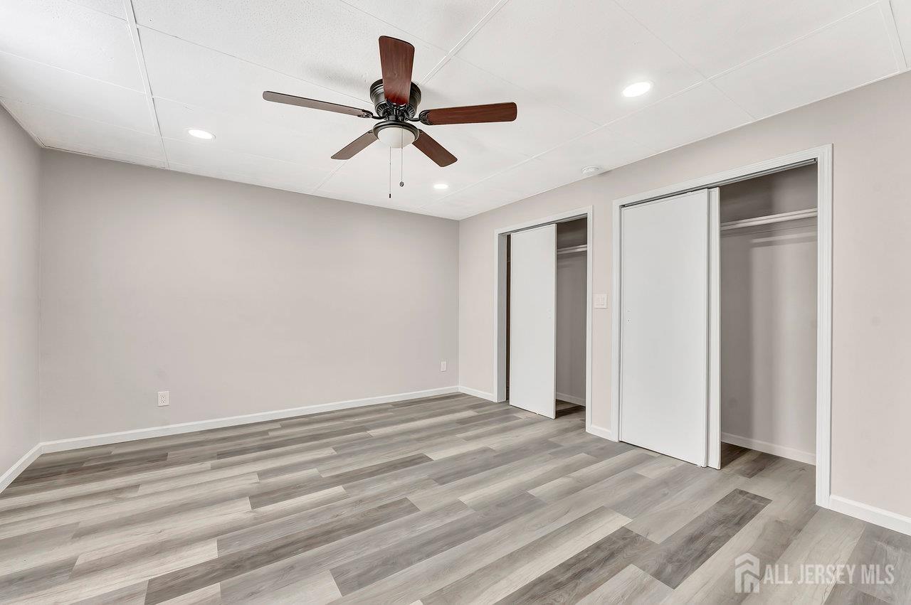 601 Ridgeway Avenue South Amboy, NJ 08879 - Photo 28 of 36 a view of a livingroom with a ceiling fan and wooden floor