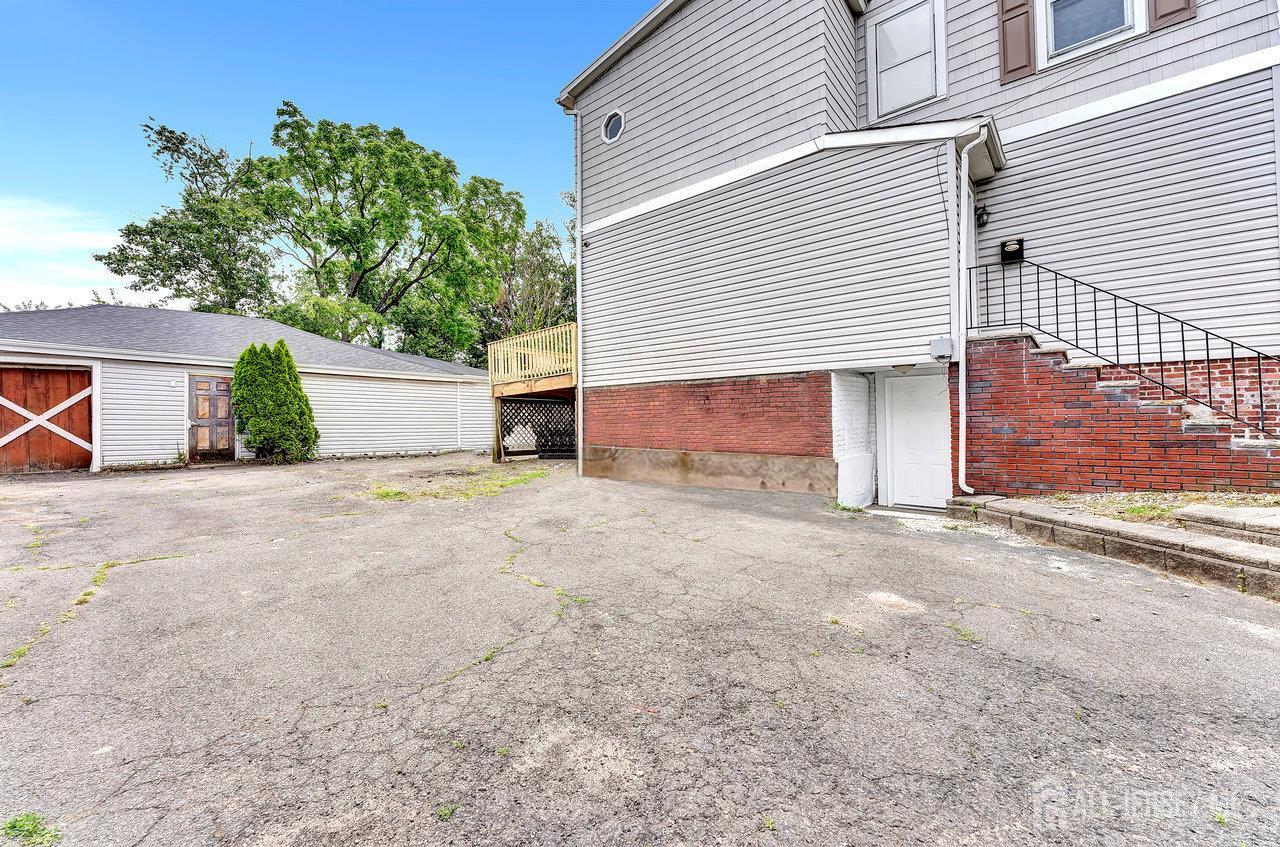 601 Ridgeway Avenue South Amboy, NJ 08879 - Photo 35 of 36 a view of a house with a yard and garage