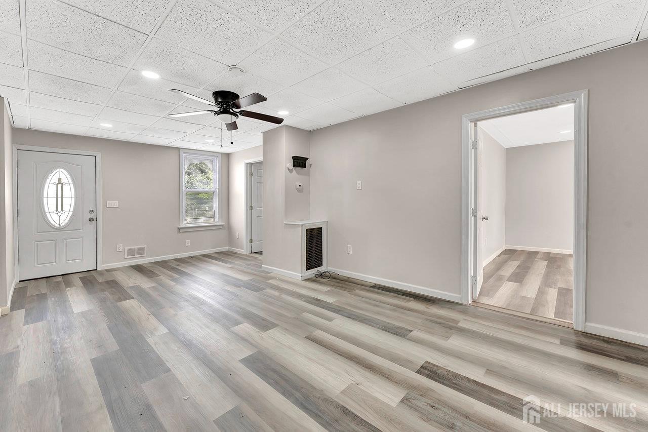 601 Ridgeway Avenue South Amboy, NJ 08879 - Photo 4 of 36 a view of an empty room and window and wooden floor