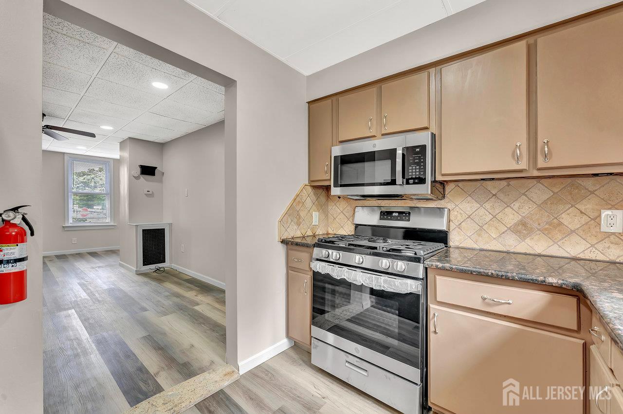601 Ridgeway Avenue South Amboy, NJ 08879 - Photo 6 of 36 a kitchen with a stove and a microwave