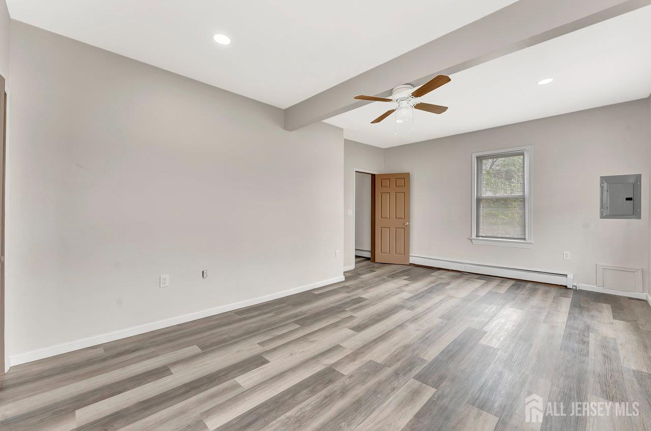 601 Ridgeway Avenue South Amboy, NJ 08879 - Photo 10 of 36 wooden floor in an empty room with a window