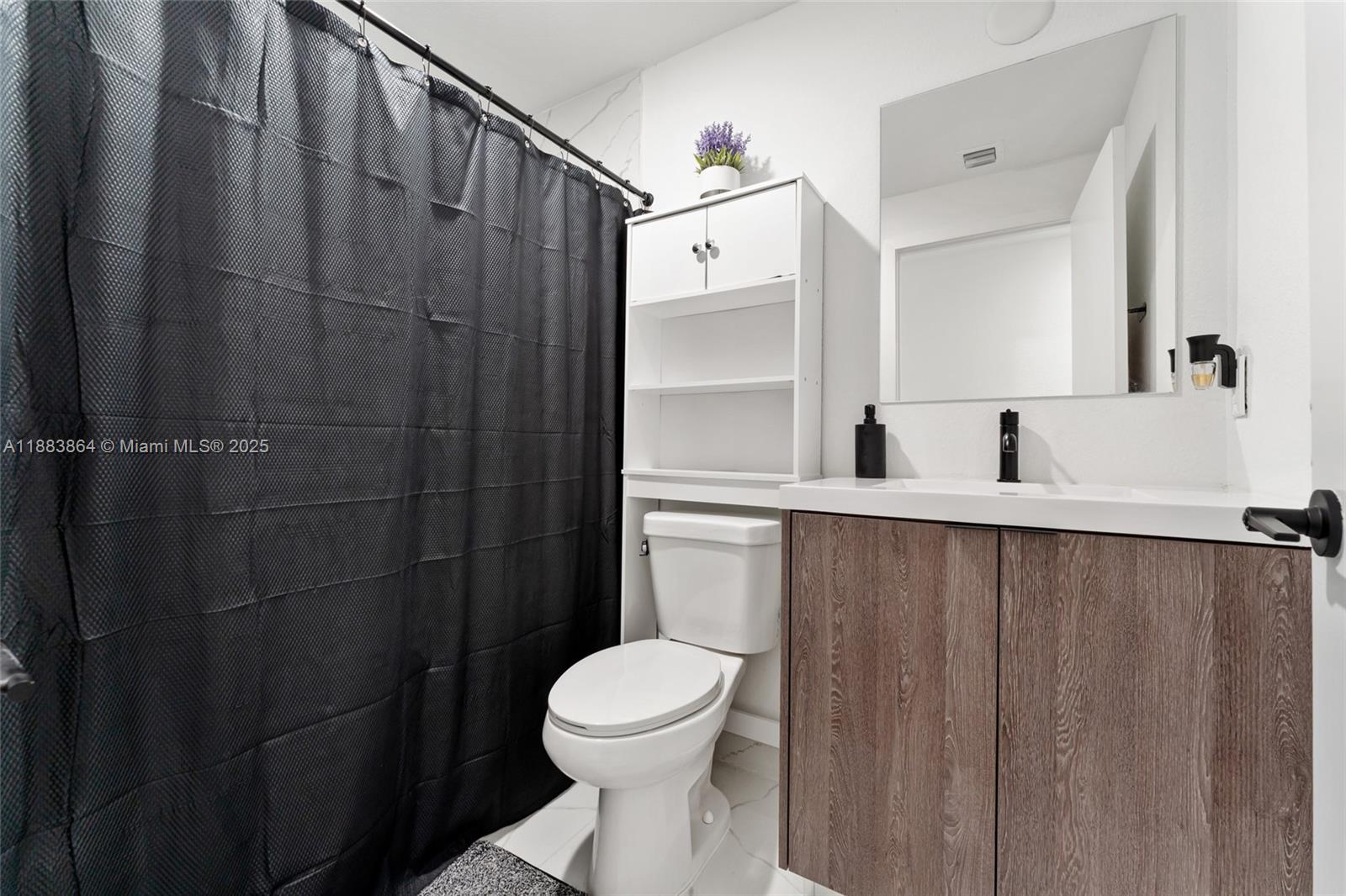 14590 Southwest 260th Street Homestead, FL 33032 - Photo 11 of 23 a bathroom with a toilet sink and shower