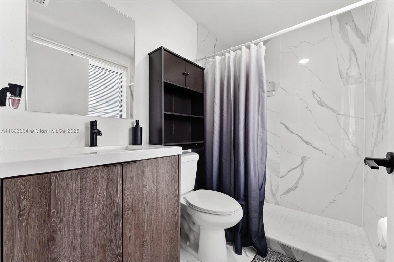 14590 Southwest 260th Street Homestead, FL 33032 - Photo 14 of 23 a bathroom with a sink toilet and shower