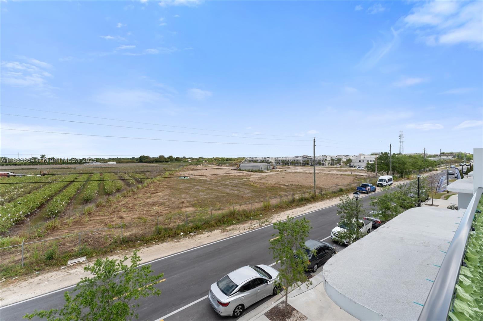 14590 Southwest 260th Street Homestead, FL 33032 - Photo 21 of 23 a view of a lake with a city view
