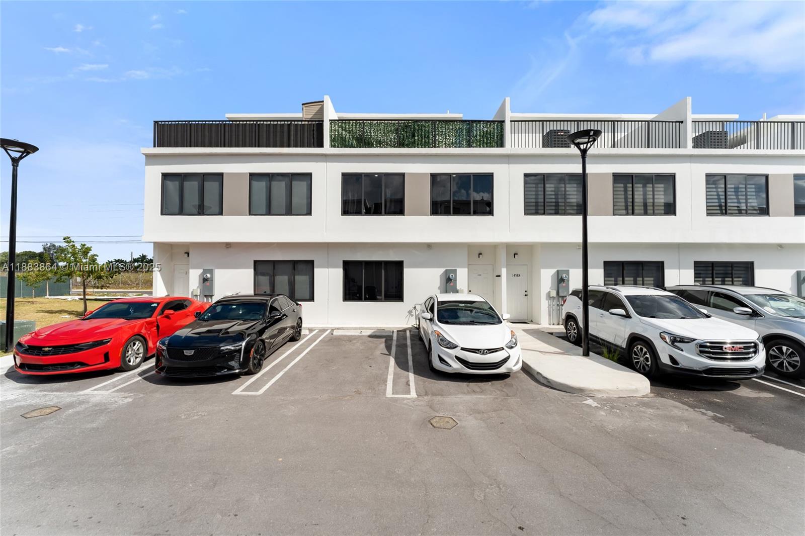 14590 Southwest 260th Street Homestead, FL 33032 - Photo 23 of 23 a car parked in front of a building