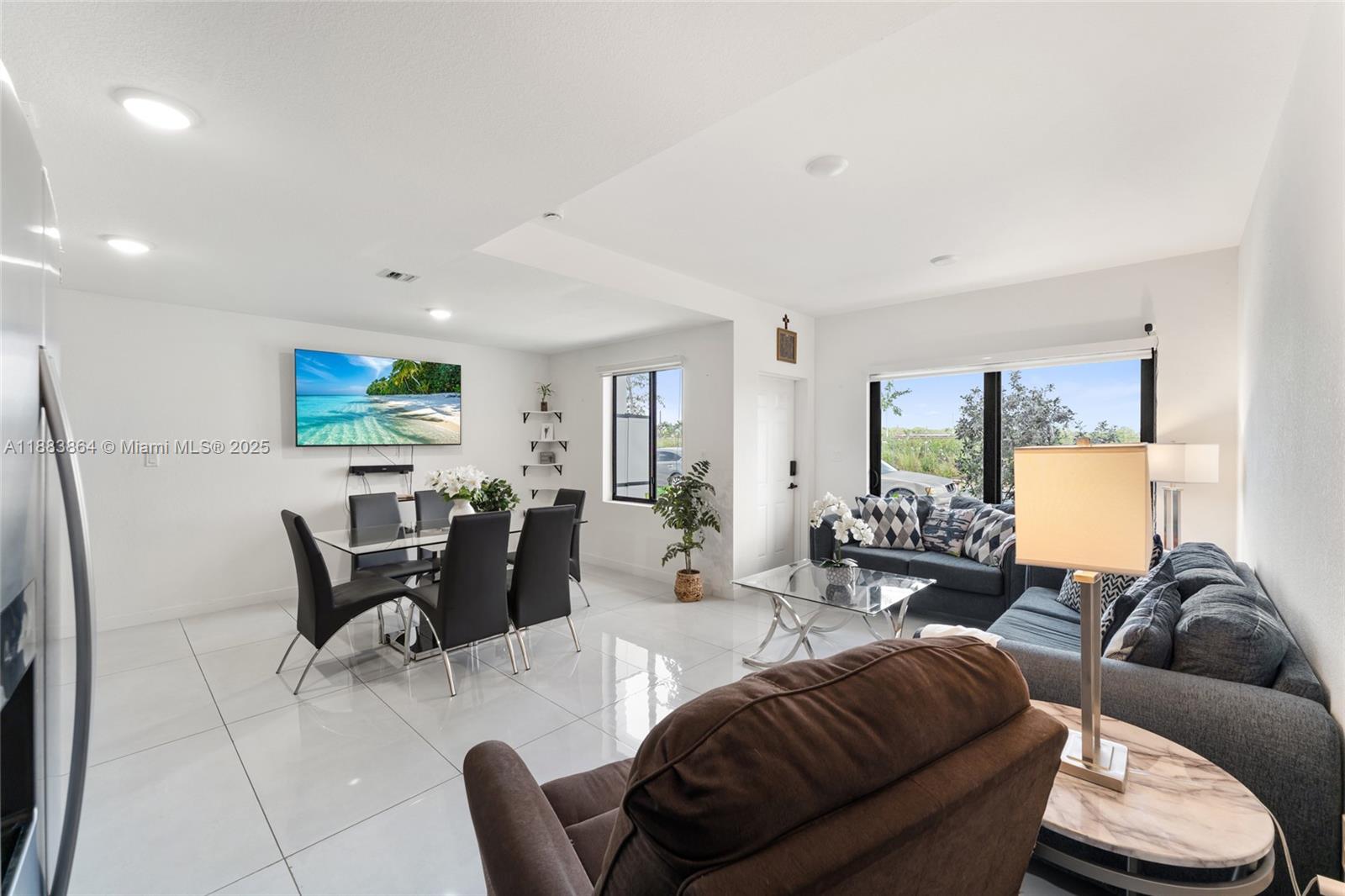 14590 Southwest 260th Street Homestead, FL 33032 - Photo 5 of 23 a living room with furniture and a large window