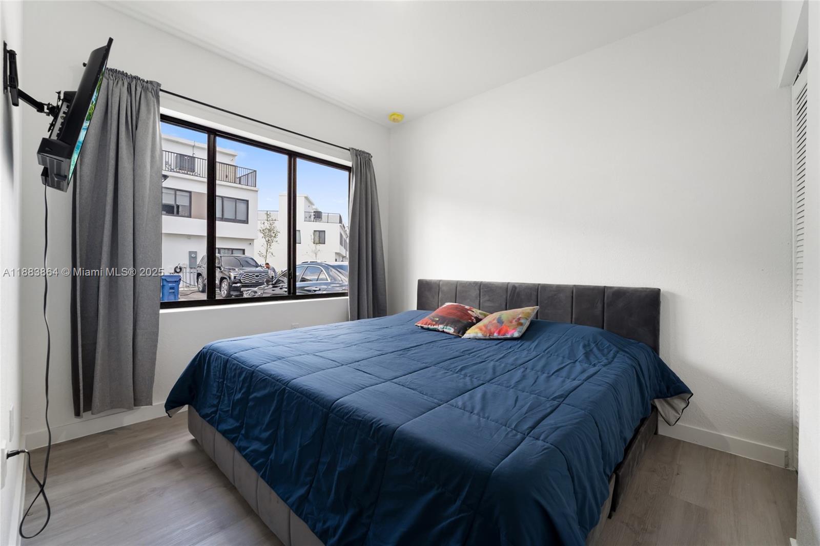 14590 Southwest 260th Street Homestead, FL 33032 - Photo 7 of 23 a bedroom with a bed and a large window