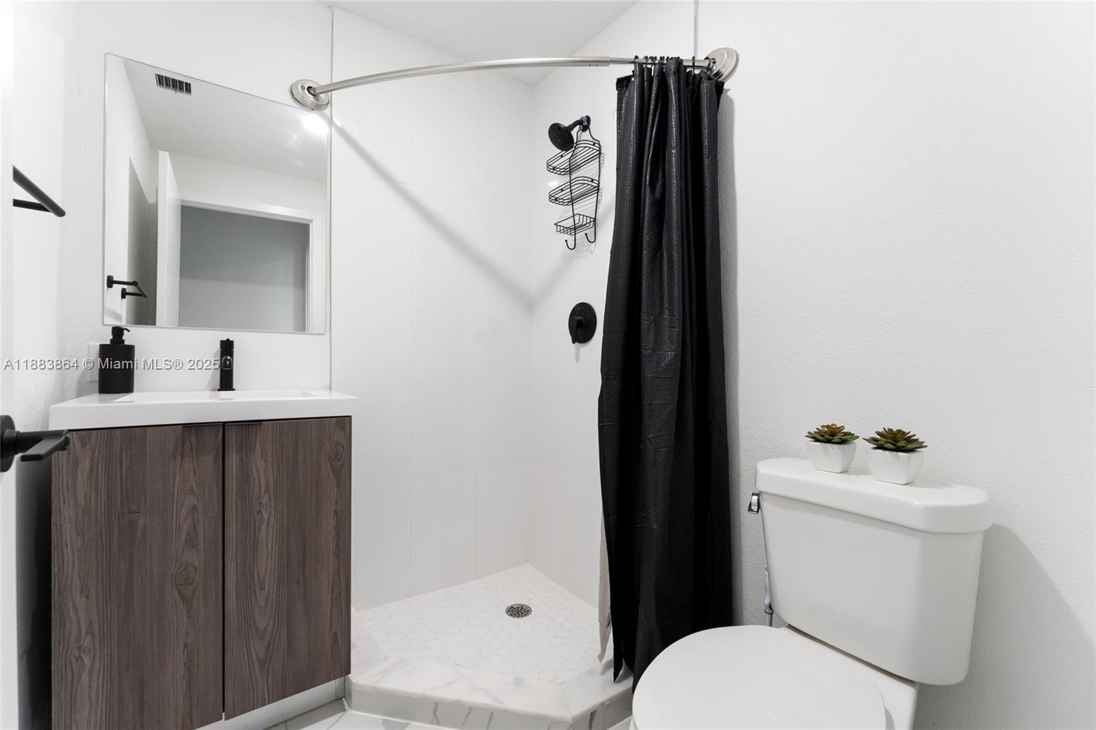 14590 Southwest 260th Street Homestead, FL 33032 - Photo 8 of 23 a bathroom with a sink and toilet