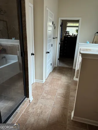 a view of a hallway view with wooden floor and staircase