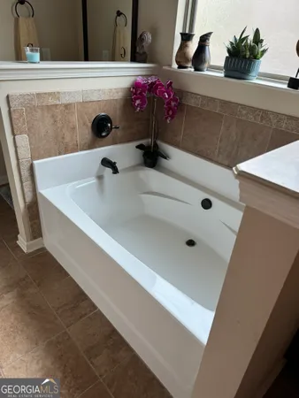 a bathroom with a sink and mirror