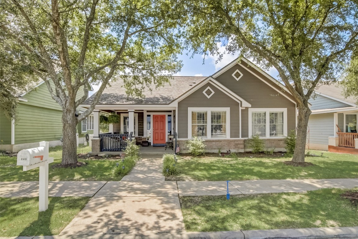 240 Hogan Kyle, TX 78640 - Photo 1 of 1 a front view of a house with a yard