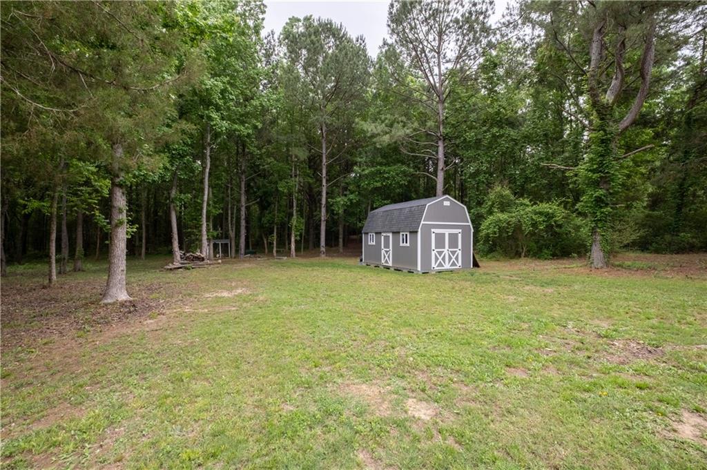 719 Fairview Road Brooks, GA 30205 - Photo 35 of 35 a house with trees in the background