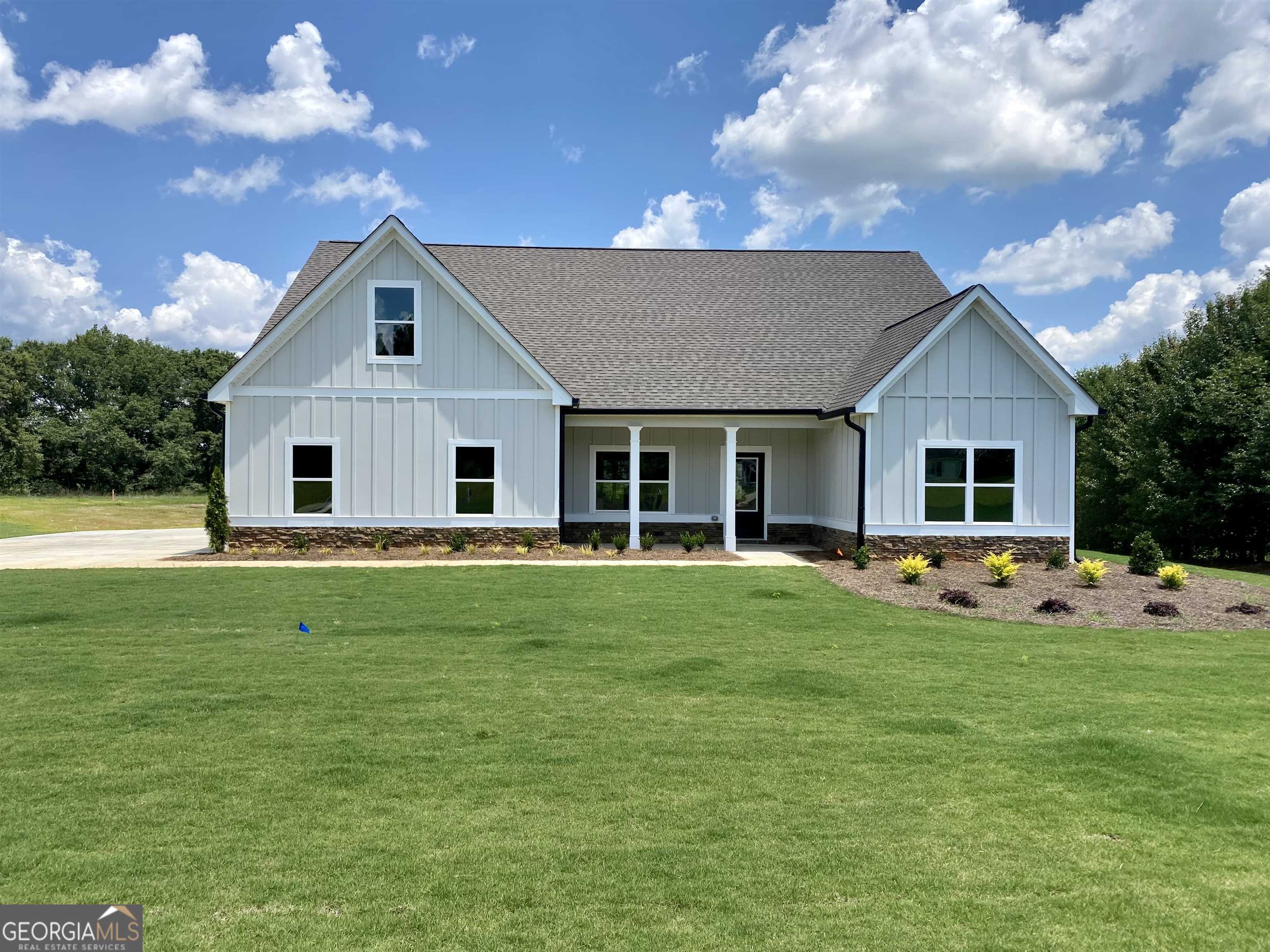 a front view of house with garden